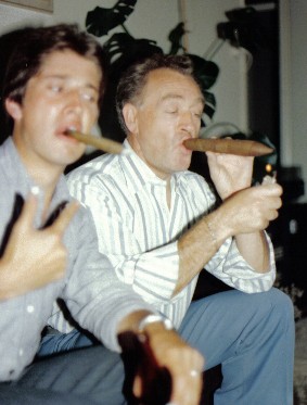 two men celebrating by smoking cigars