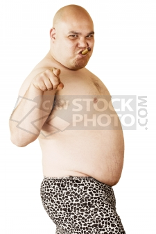 Fat bald chav bogan yobbo in leopard print shorts smoking a cigar