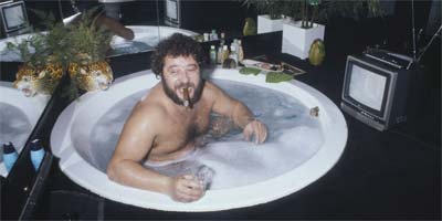 Man smoking a cigar in spa pool