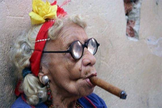 Strange woman smoking a cigar
